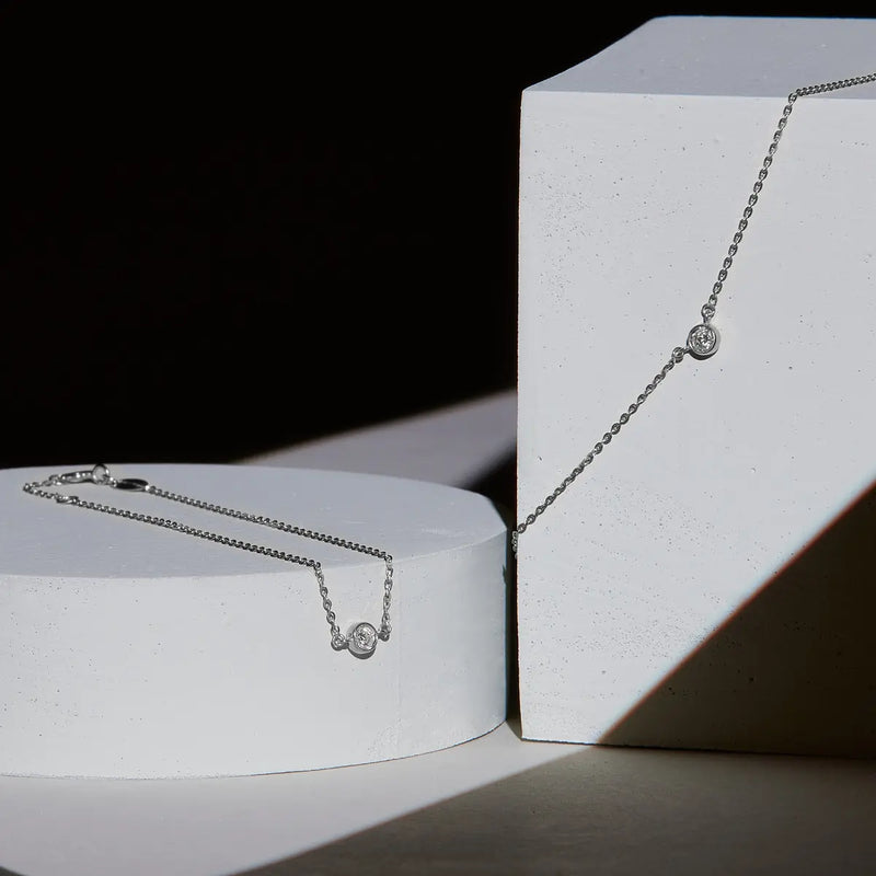 Geometrie di Luce Collana e Bracciale Punto Oro Bianco e Diamanti