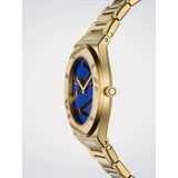 D1 Milano Ultra Thin Royal Inlay vista laterale cassa dorata con corona e quadrante blu geometrico dettaglio spessore UCBL02