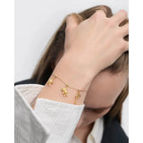 Pd Paola Ciondolo Orsacchiotto su bracciale oro con charm stella e chiave, vista indossata al polso CH01-306-U