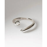 Pdpaola Anello Caramelle aperto in ottone rodiato con zircone centrale incastonato a castone, design minimal ANB2-D69-08