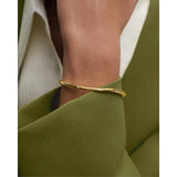 Pdpaola Essentials 2026 Air Bangle dettaglio zirconi cubici su bracciale rigido placcato oro 18kt indossato PU01-999-S