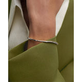 Pdpaola Bracciale Air Silver Bangle indossato al polso, dettaglio zirconi cubici su argento rodiato lucido PU02-999-S