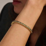 Ti Sento Bracciale Intrecciato indossato su polso, dettaglio lavorazione torchon dorata e finitura lucida 23095SY/S
